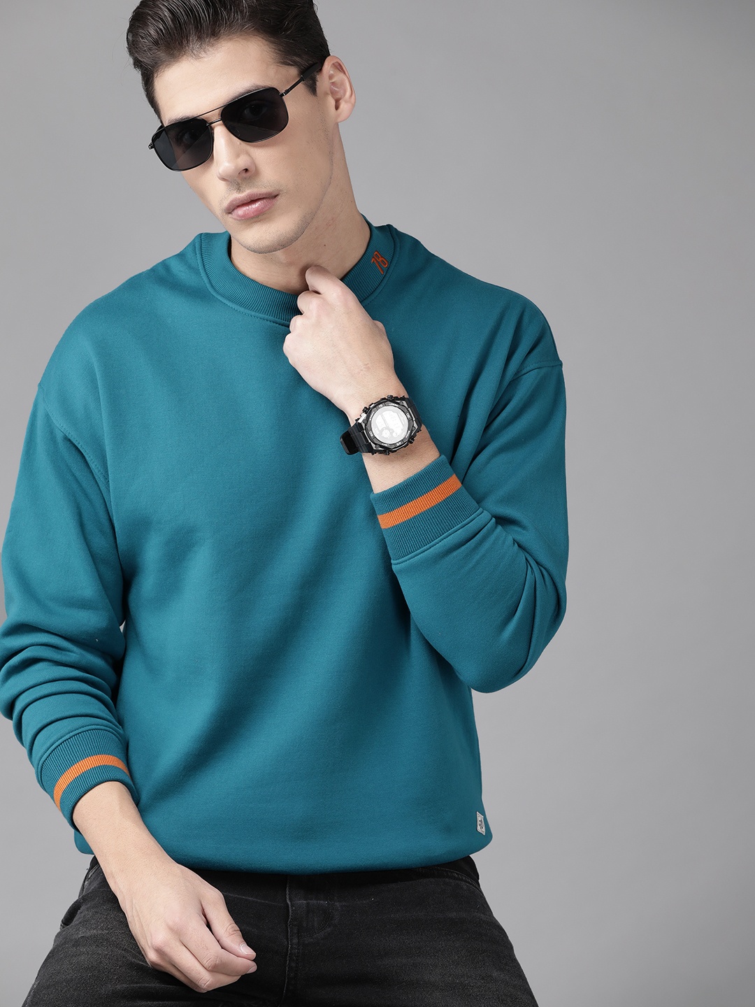 

Roadster Men Teal Blue Solid Sweatshirt