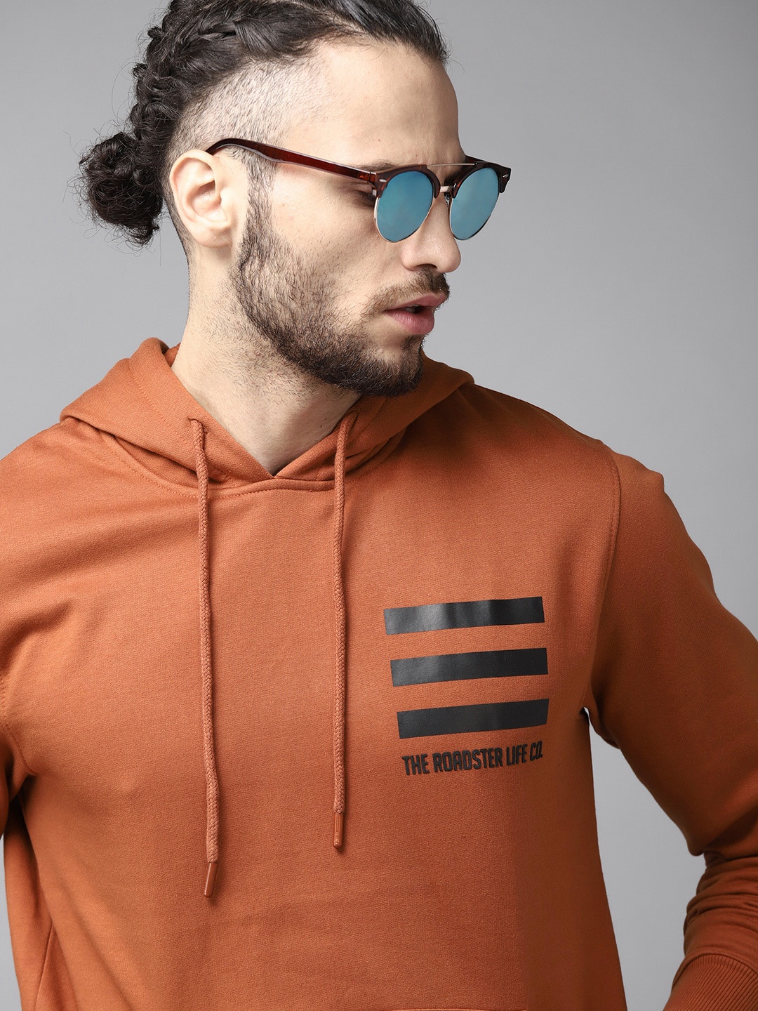 

Roadster Men Rust Orange & Black Solid Hooded Sweatshirt with Striped Detail