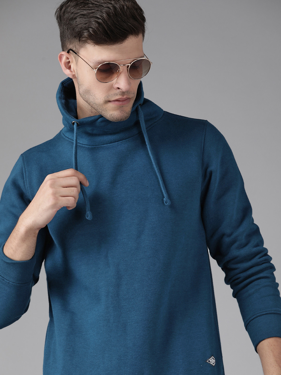 

Roadster Men Teal Blue Solid Sweatshirt