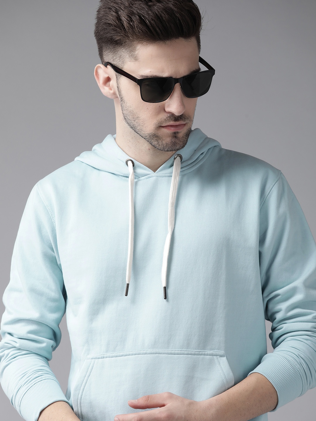 

Roadster Men Blue Solid Hooded Kangaroo Pocket Sweatshirt