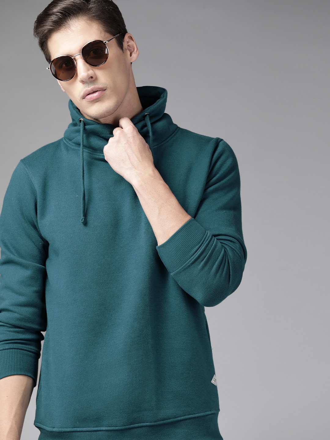 

Roadster Men Teal Blue Solid Sweatshirt