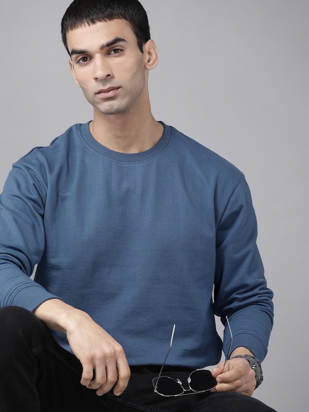 

Roadster Men Blue Solid Sweatshirt