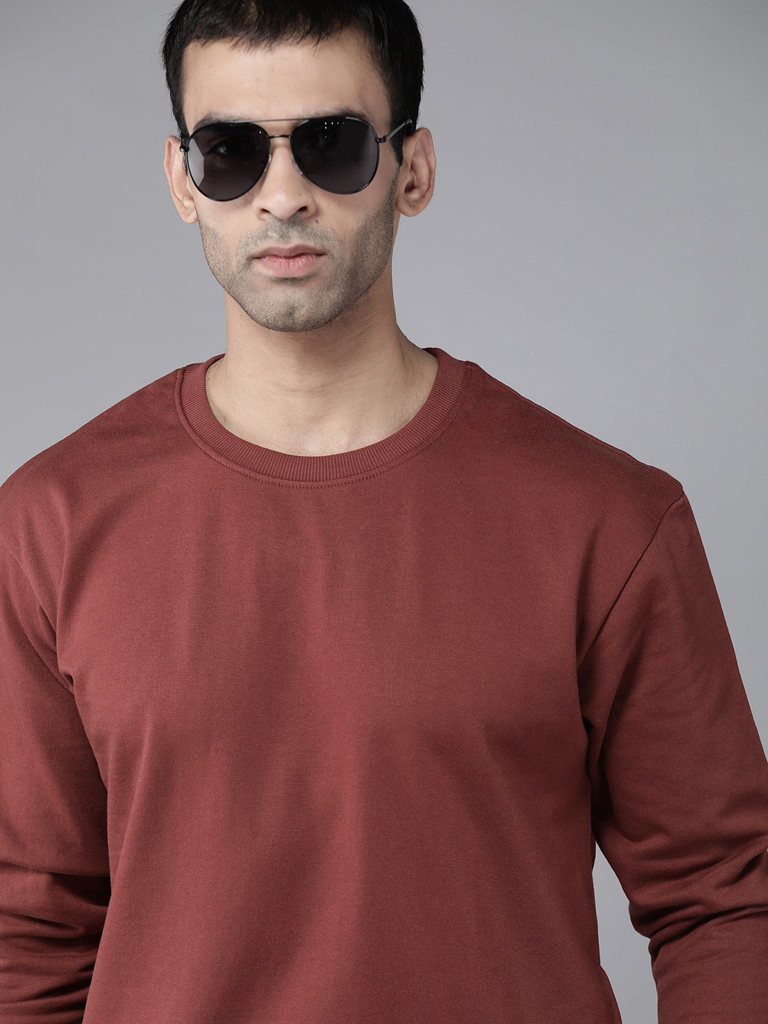 

Roadster Men Rust Red Solid Sweatshirt