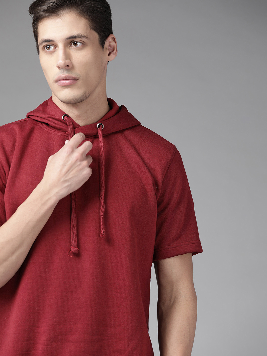 

Roadster Men Maroon Solid Hooded Sweatshirt