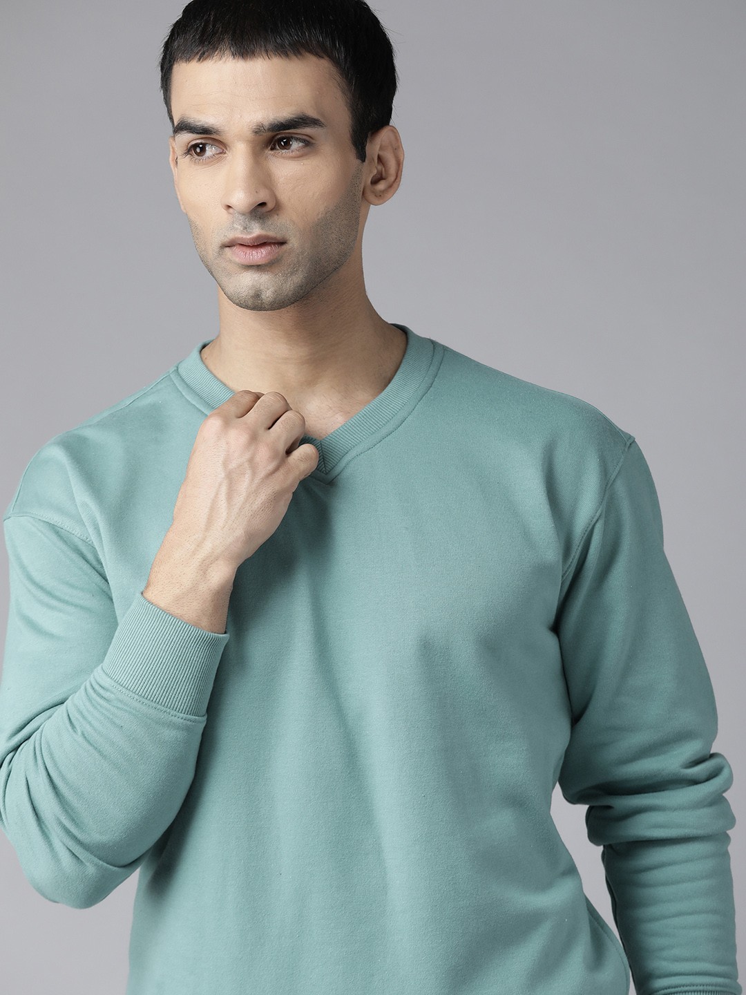 

Roadster Men Sea Green Solid Sweatshirt