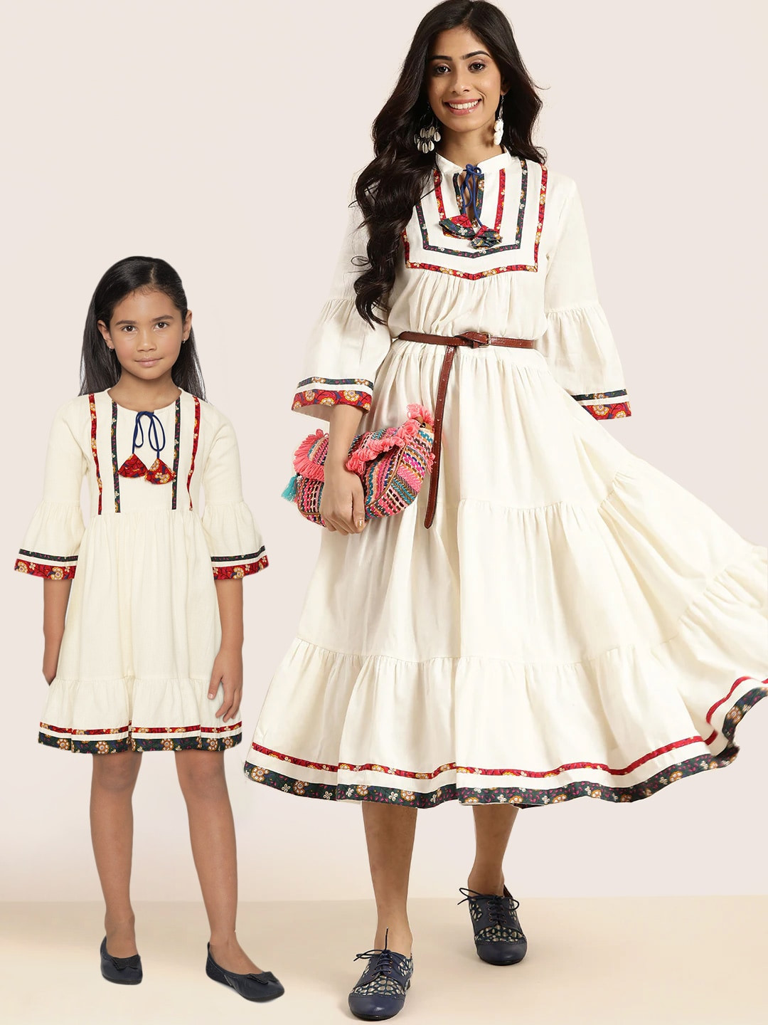 

Sangria Girls Off-White Solid Gathered A-Line Dress with Ethnic Print & Tie-Up Detail