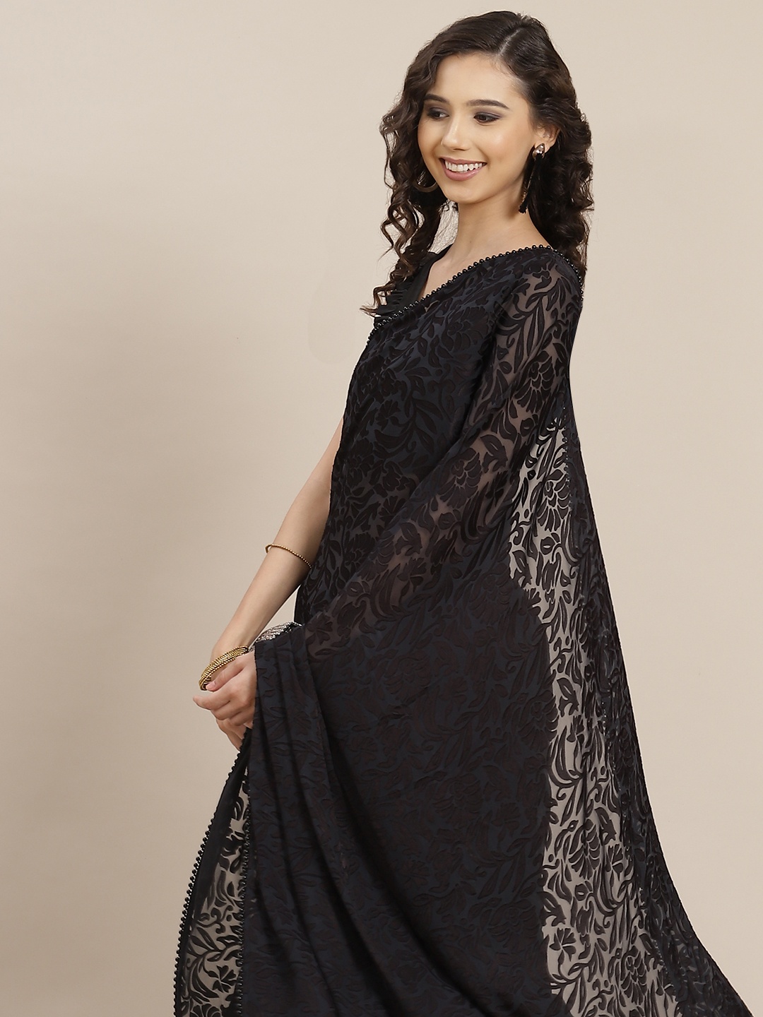 

Inddus Black Ethnic Motifs Woven Design Net & Brasso Half and Half Saree