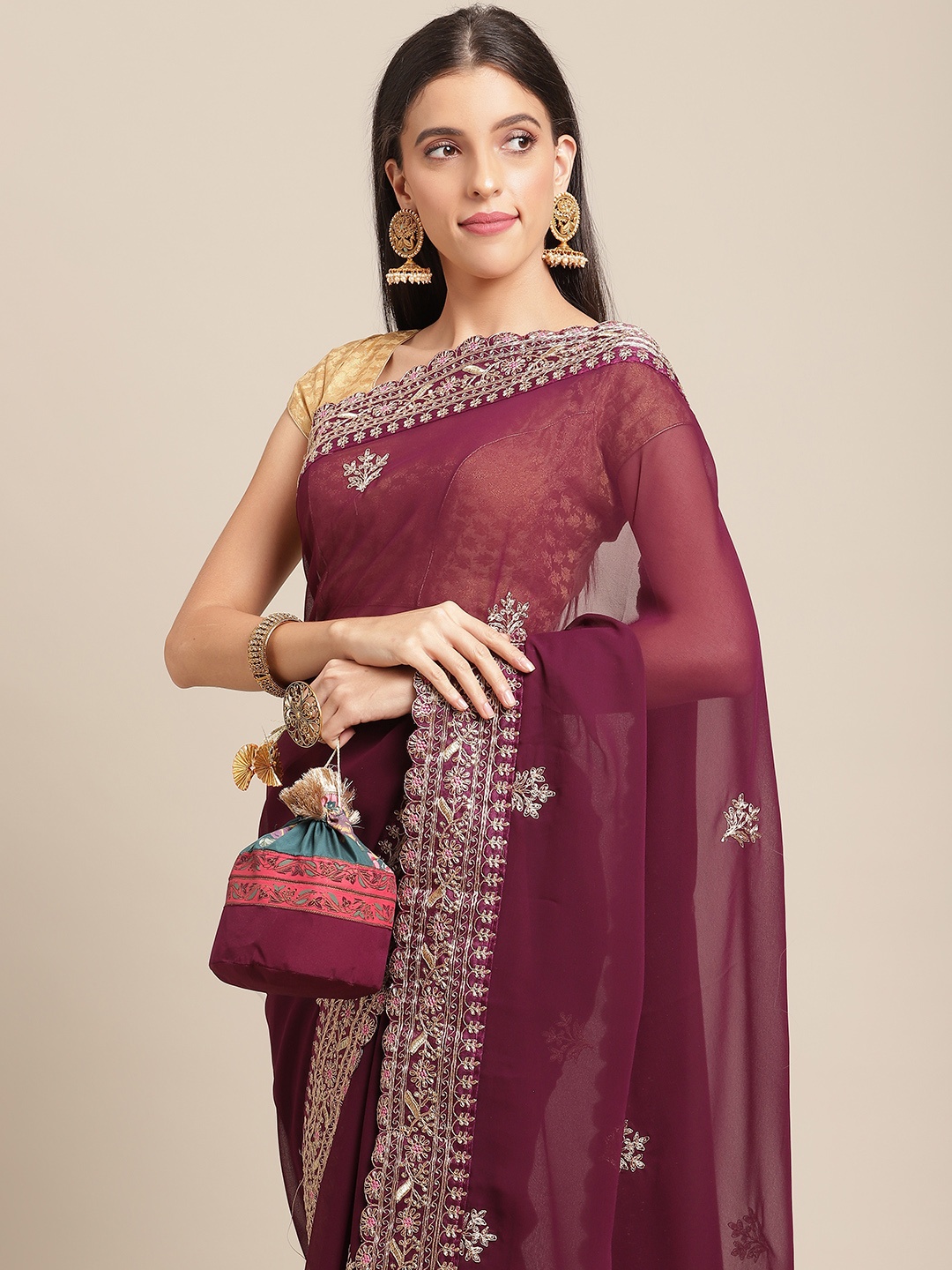 

Anouk Burgundy Ethnic Motifs Embellished Saree