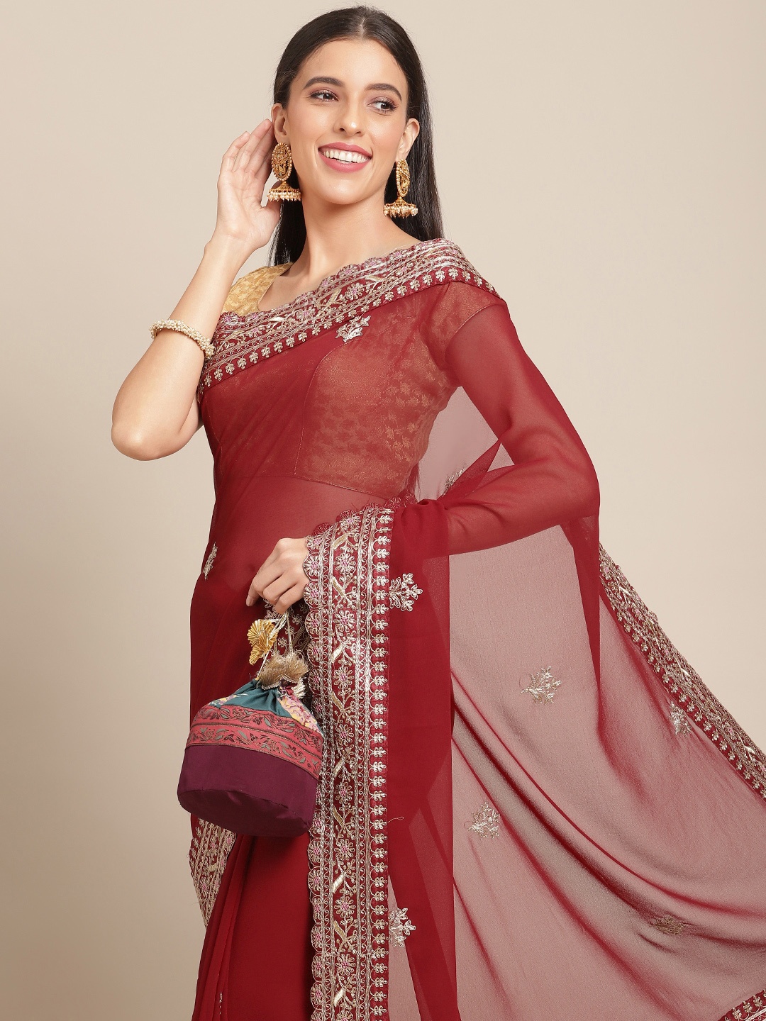 

Anouk Maroon & Golden Woven Design Georgette Saree