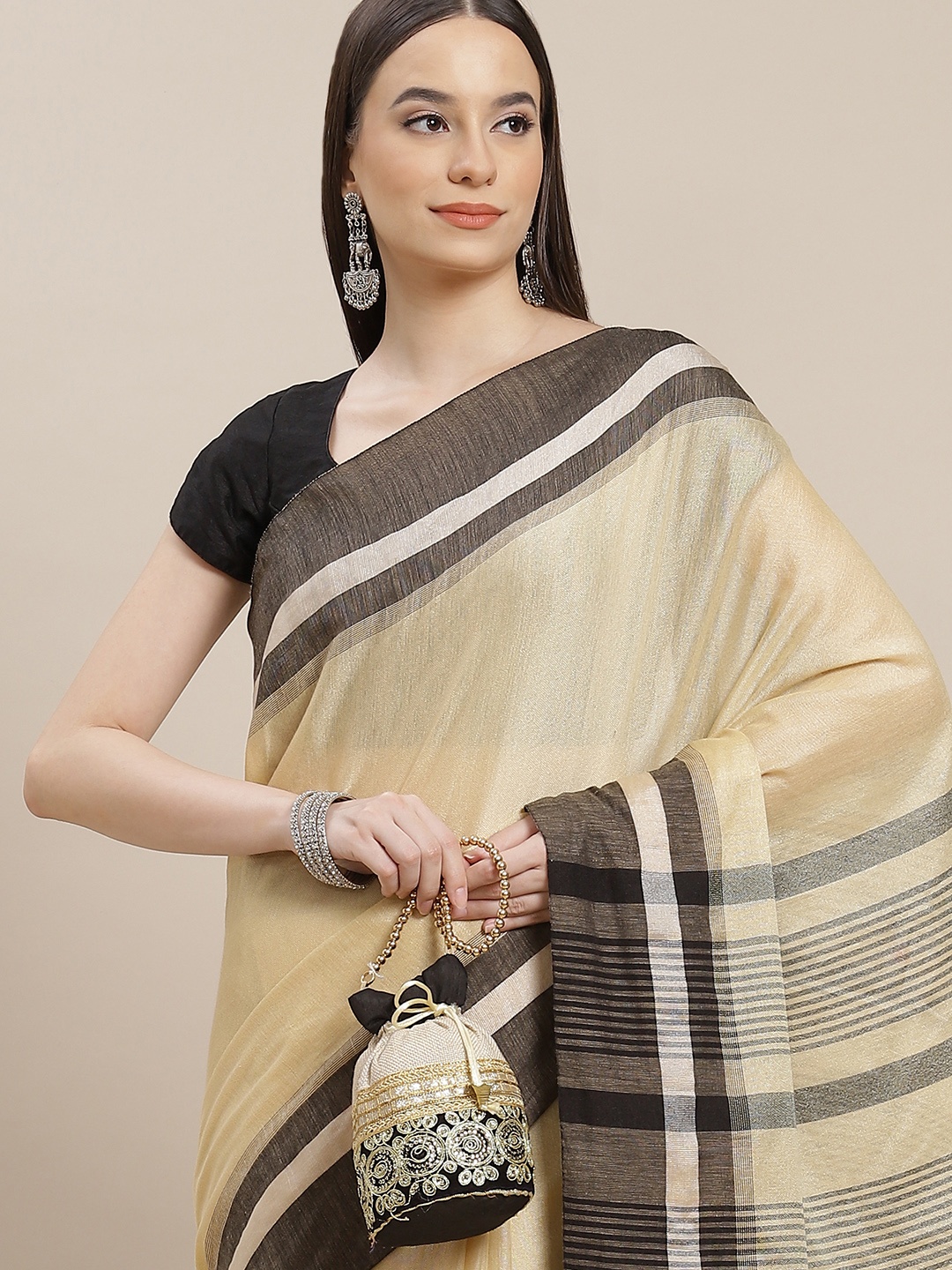 

Anouk Beige Solid Saree
