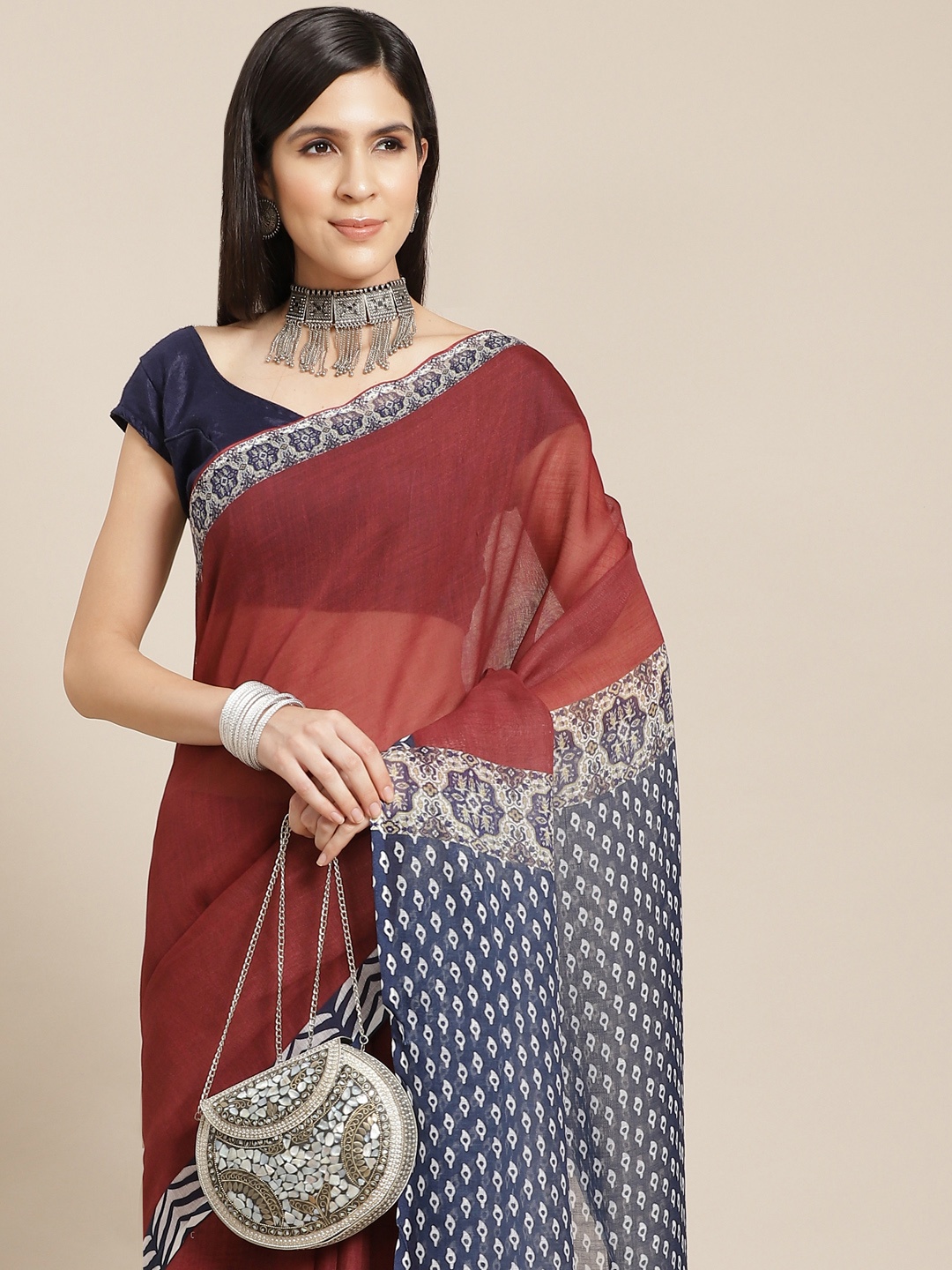 

Anouk Maroon Solid Saree