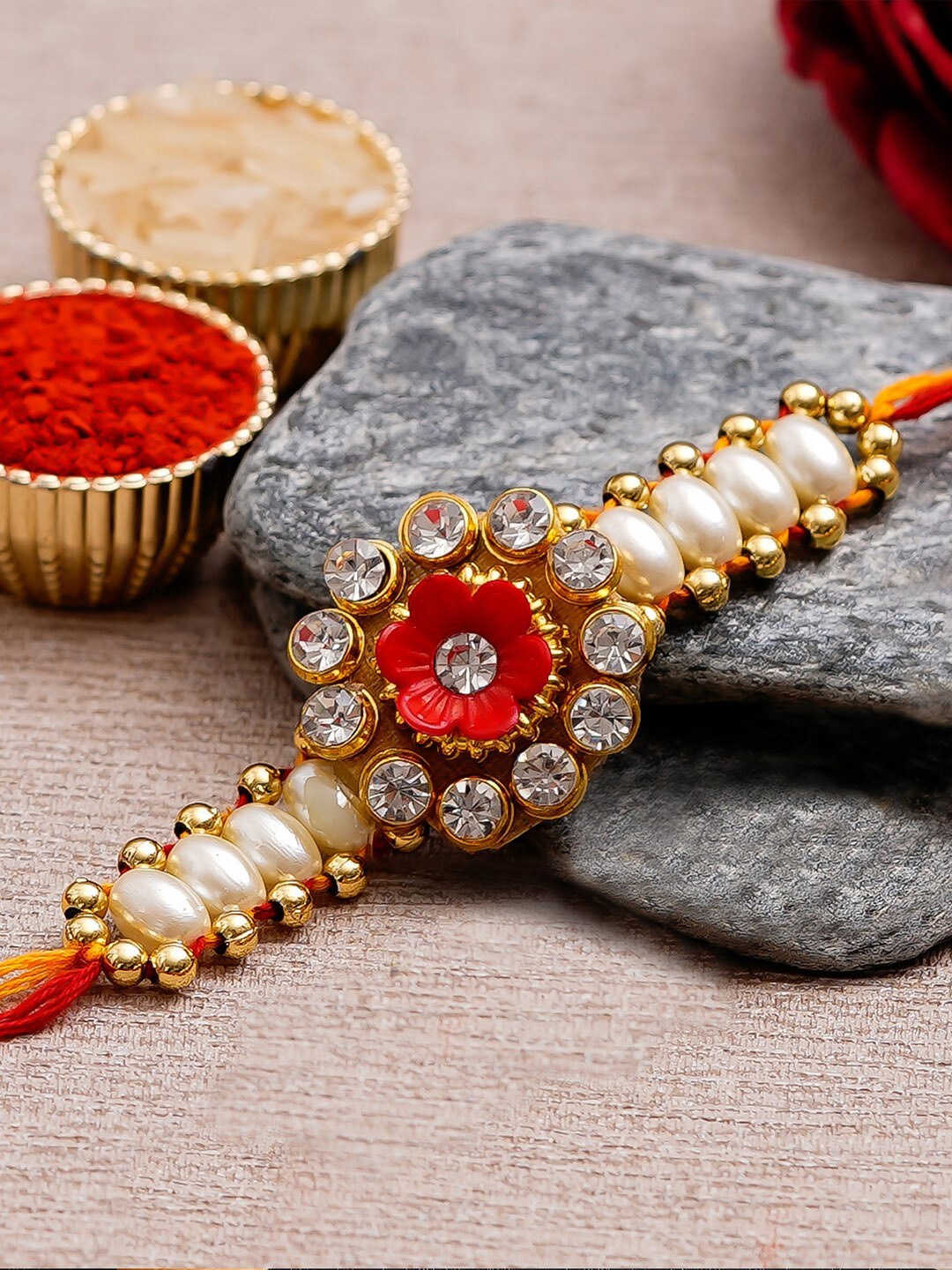 

eCraftIndia White & Gold-Toned Desinger Rakhi and Roli Chawal Set