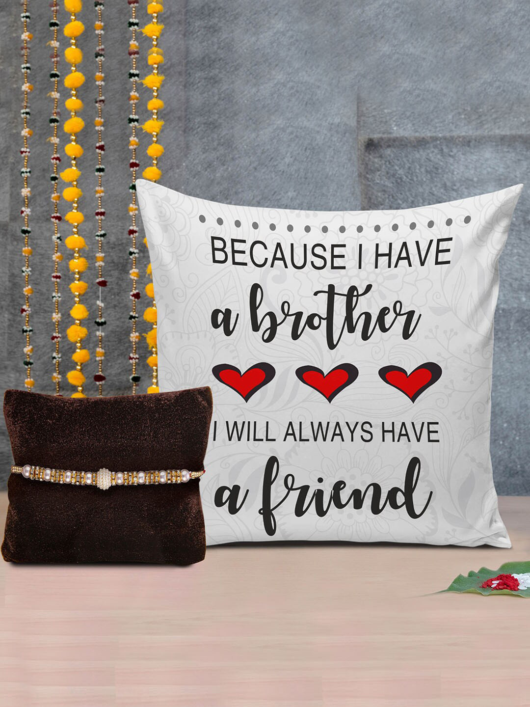 

TIED RIBBONS Multicoloured Designer Rakhi with Printed Cushion & Roli Chawal Gift Pack, Multi