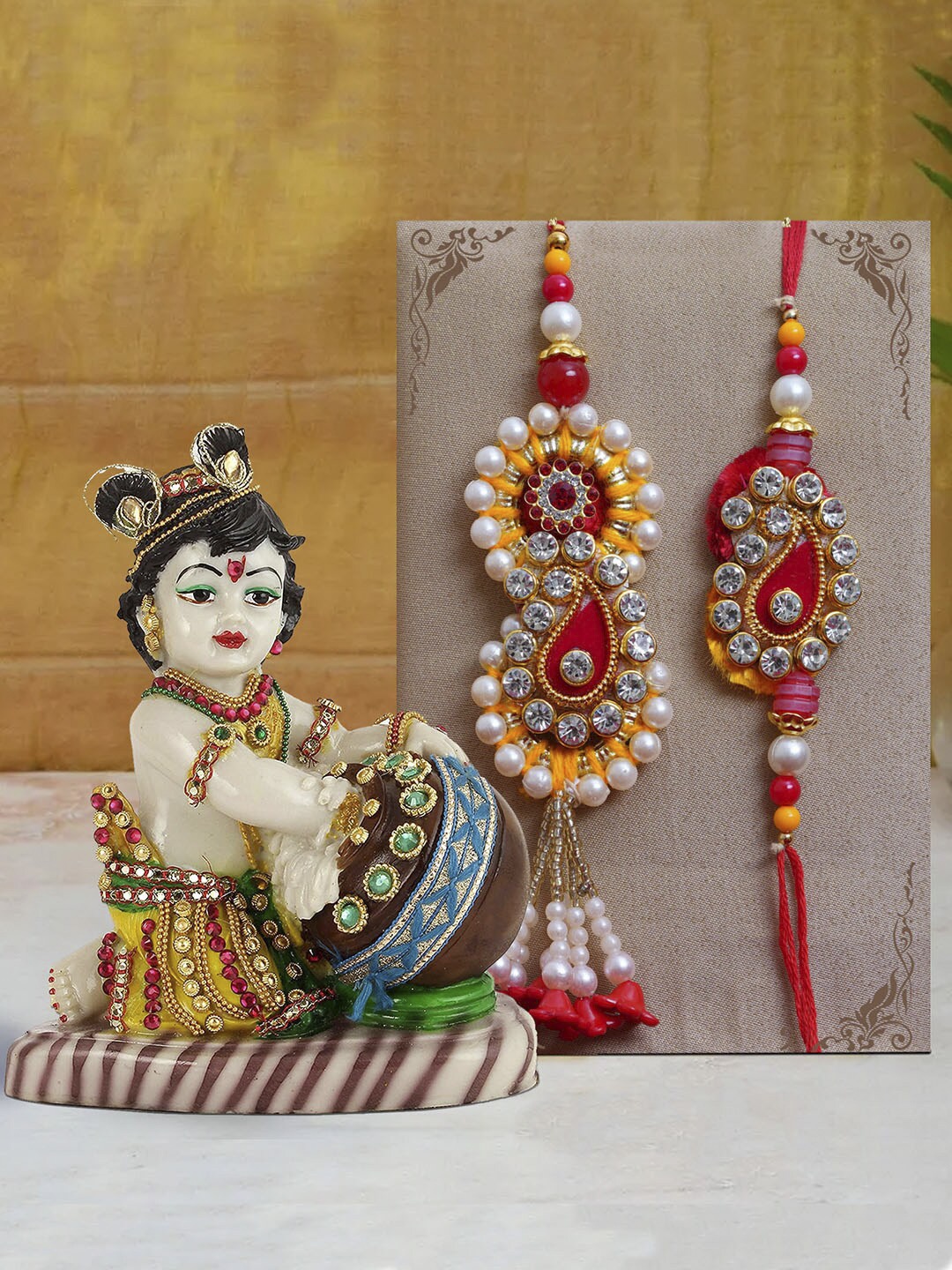 

TIED RIBBONS Multicoloured Bhaiya Bhabhi Lumba Rakhi with Krishna Idol Combo Gift Set, Multi