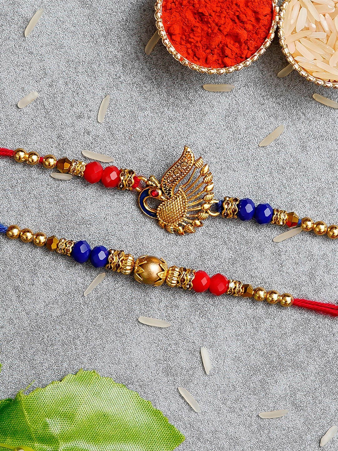 

eCraftIndia Set Of 2 Stones & Beads-Studded Rakhis & Roli Chawal Pack, Blue