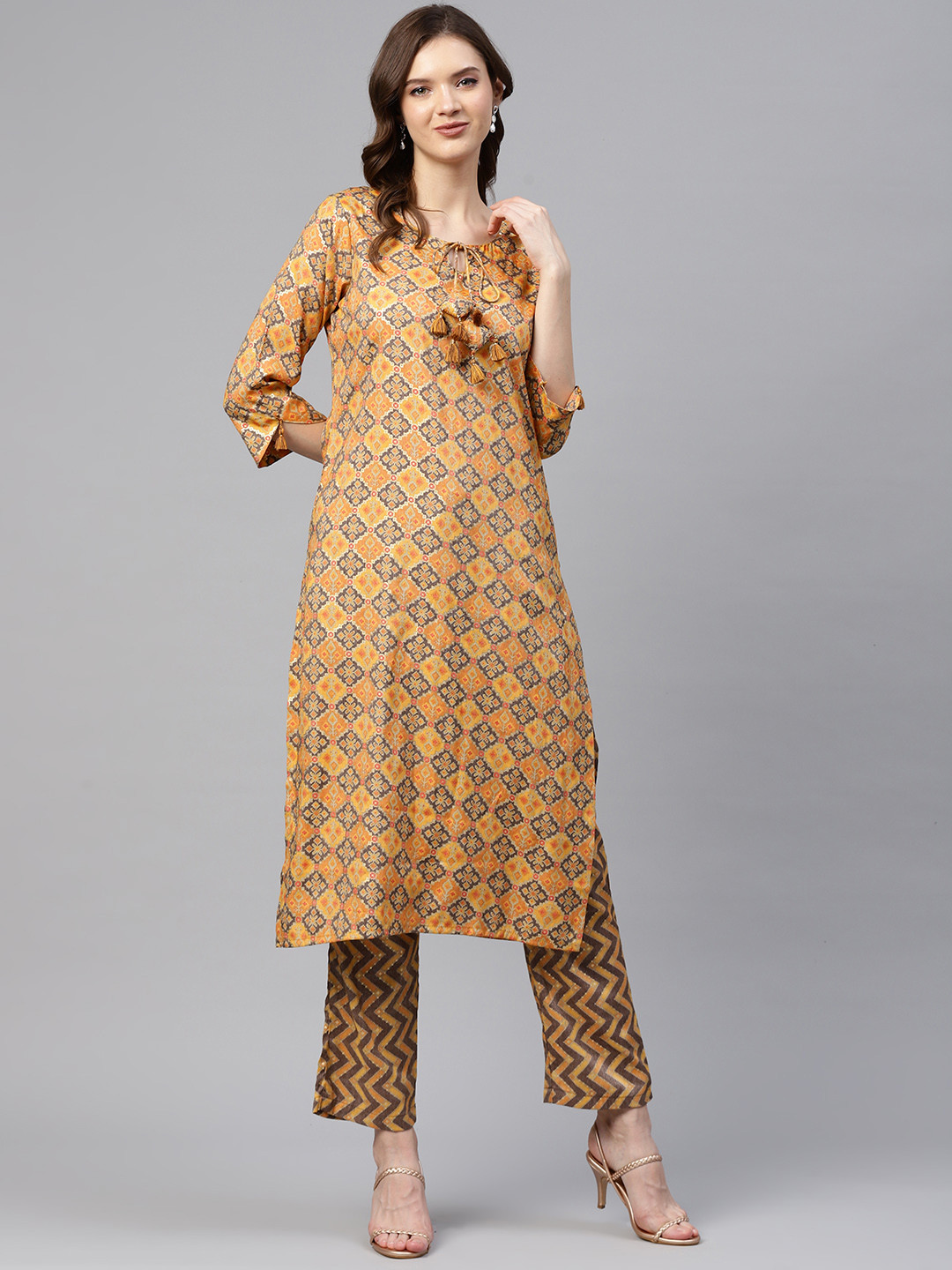 

Readiprint Fashions Women Mustard Yellow & Grey Ikat Geometric Print Kurta with Trousers