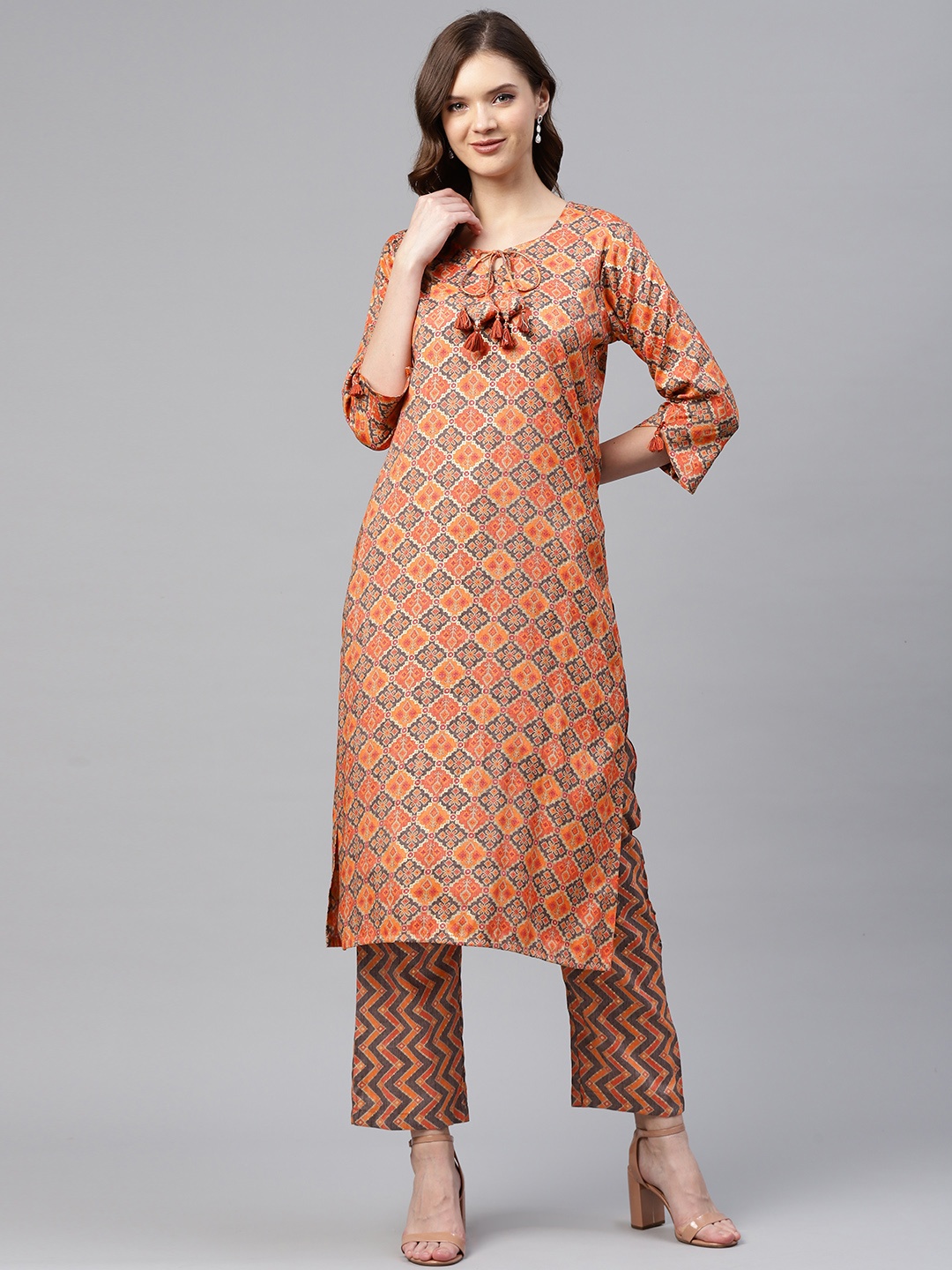 

Readiprint Fashions Women Orange & Gold Ikat Woven Design Straight Kurta with Palazzos
