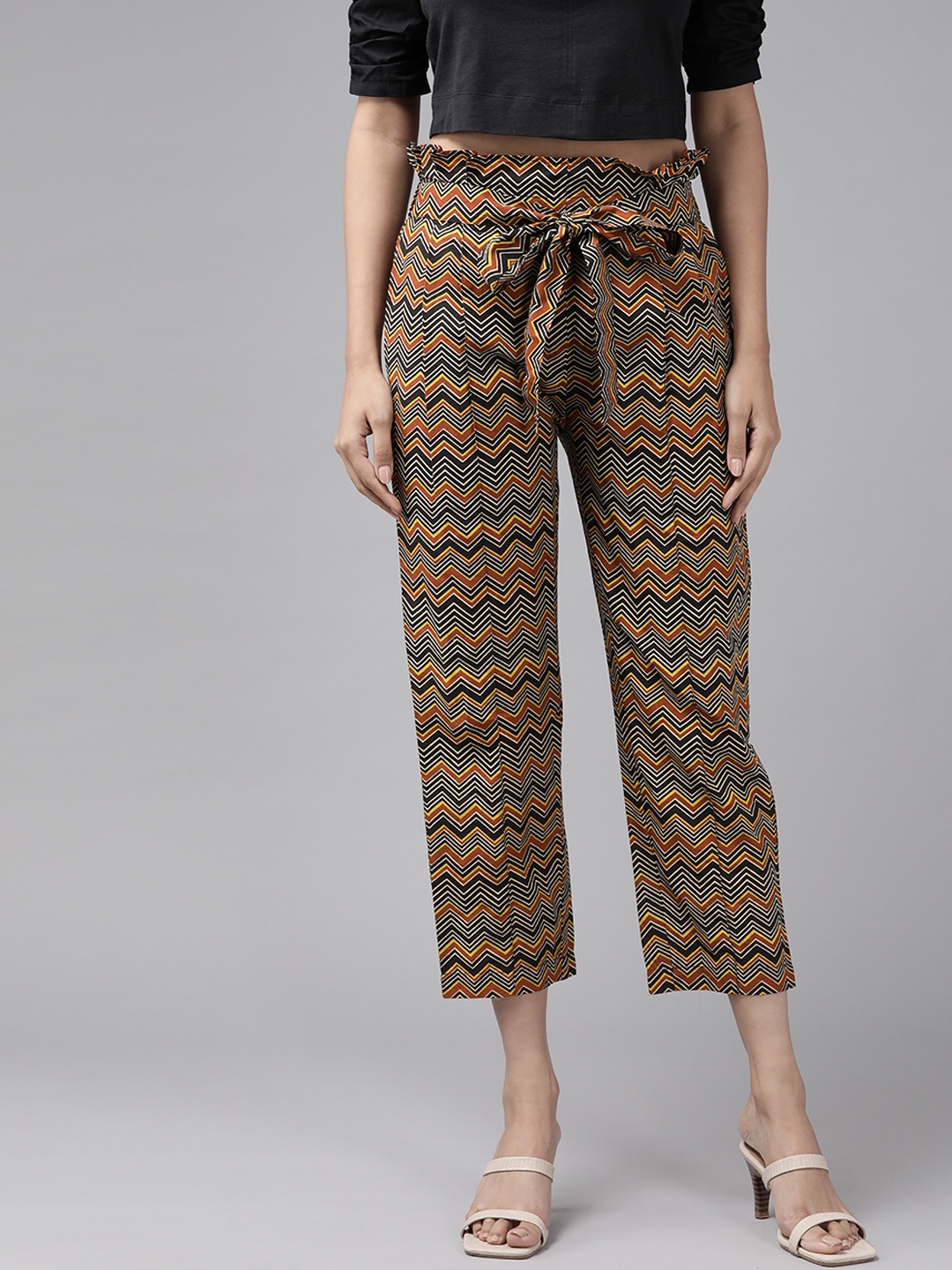 

YASH GALLERY Women Black & Biege Printed Pleated Peg Trousers