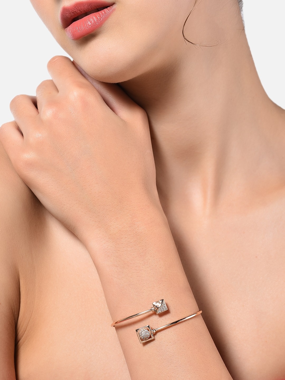 

Zaveri Pearls Rose Gold Bangle Style Kada Bracelet