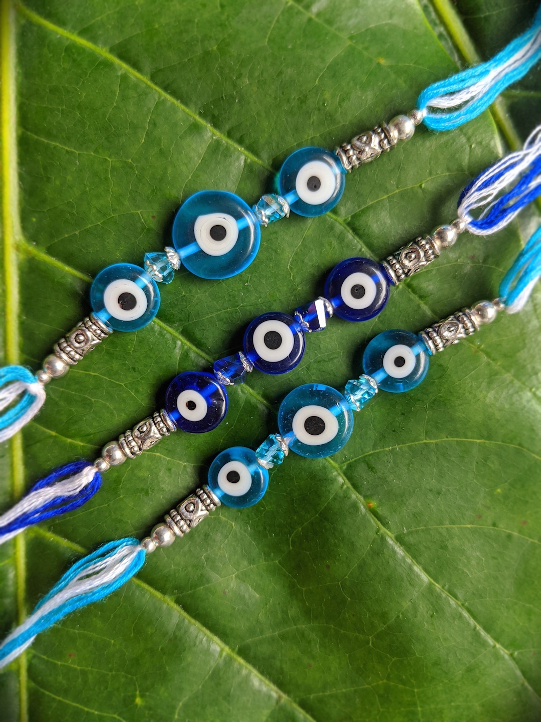 

Digital Dress Room Set Of 2 Blue & White Evil Eye Rakhis