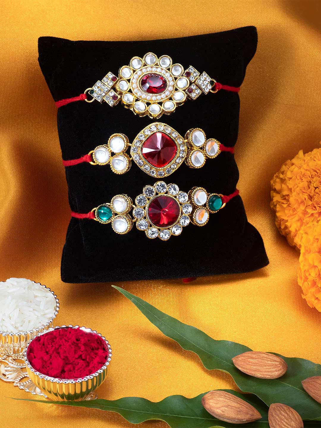 

Peora Set of 3 Handmade Kundan Rakhi with Raksha Bandhan Greeting Card & Roli Chawal, Red