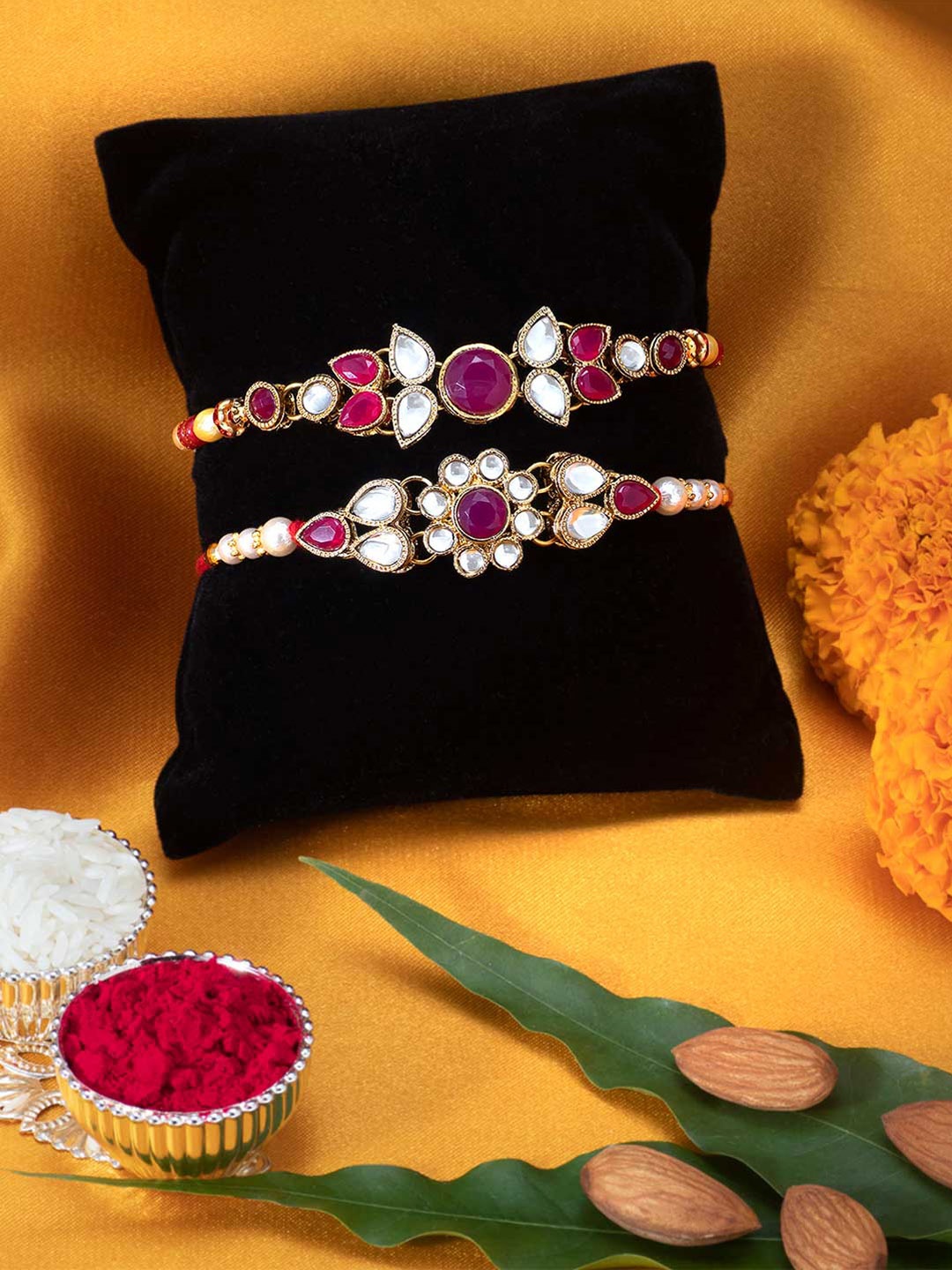 

Peora Set of 2 Handmade Kundan Rakhi with Raksha Bandhan Greeting Card & Roli Chawal, Magenta