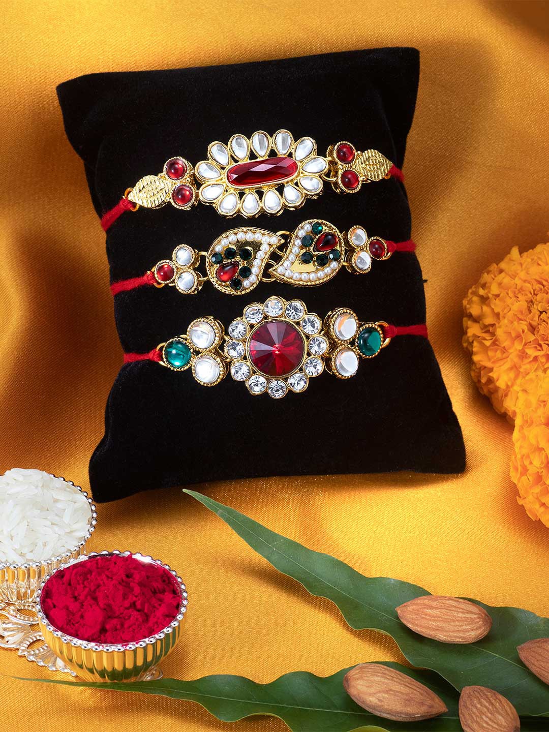 

Peora Set of 3 Handmade Kundan Rakhi with Raksha Bandhan Greeting Card & Roli Chawal, Red