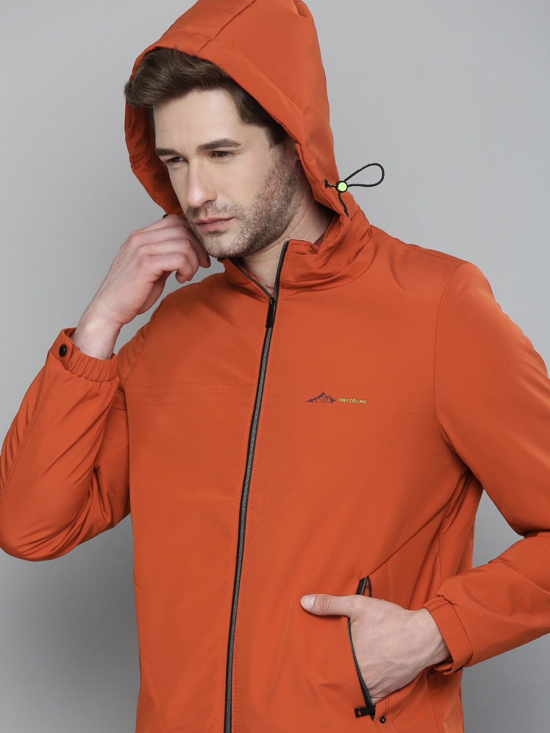 

Fort Collins Men Orange Solid Hooded Sporty Jacket
