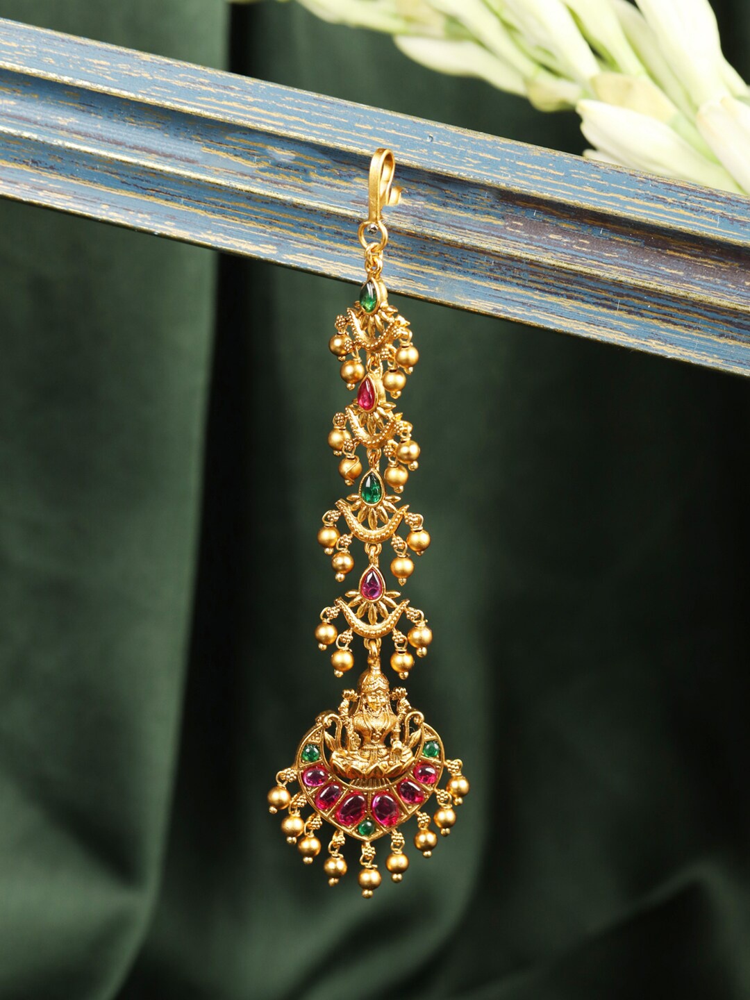 

Priyaasi Pink Gold-Plated Stone-Studded Handcrafted Goddess Lakshmi Textured Maang Tika