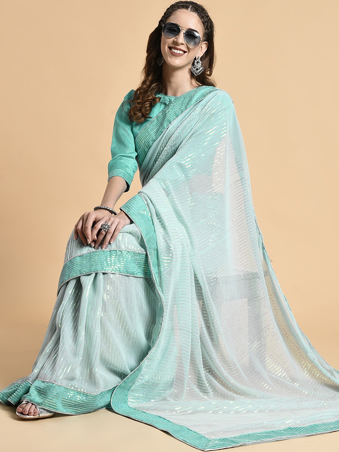

Sangria Sea Green Striped Sequinned Pure Georgette Saree