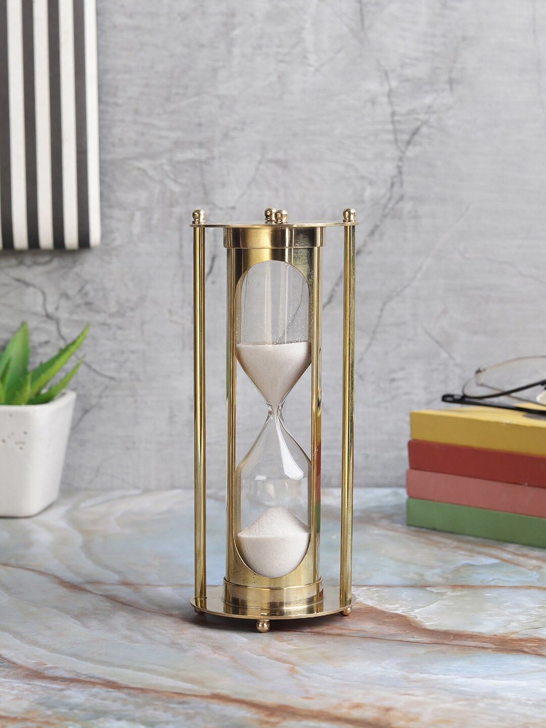 

EXIM DECOR Gold-Toned & Transparent Brass Tube Type White Sand Timer Showpiece