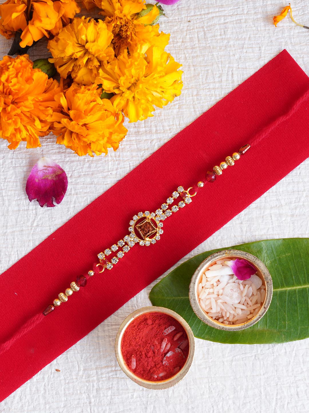 

TIED RIBBONS Red & Gold-Toned Embellished Rakhi with Roli Chawal