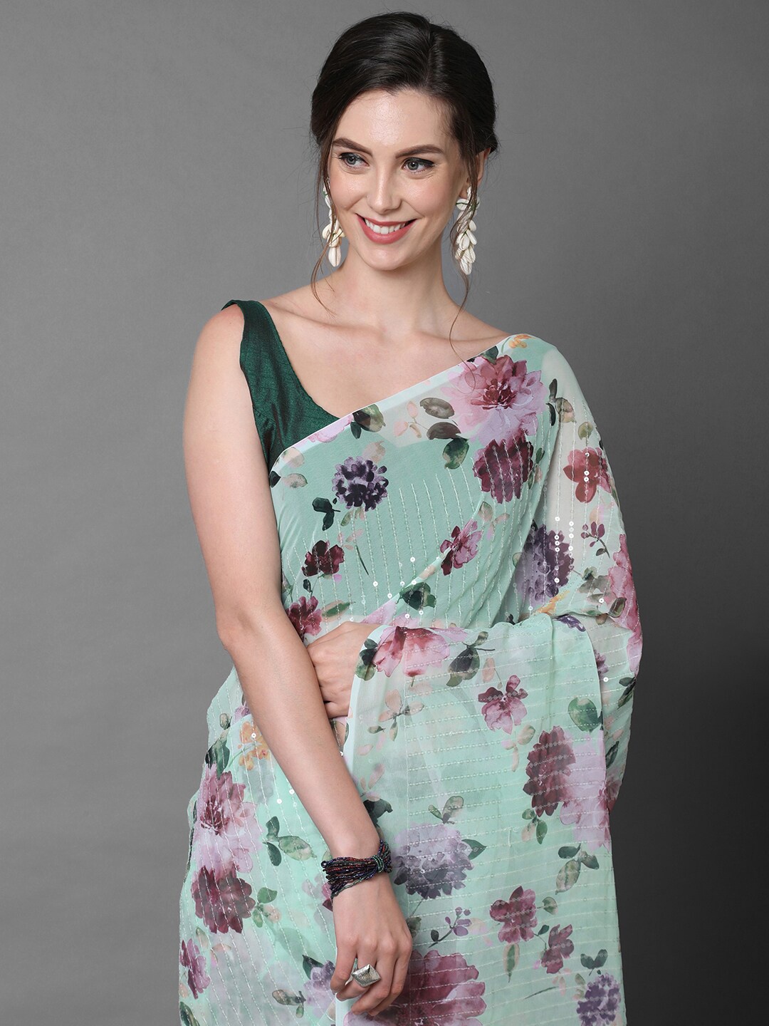 

Mitera Sea Green Georgette Floral Printed & Embellished Party Saree