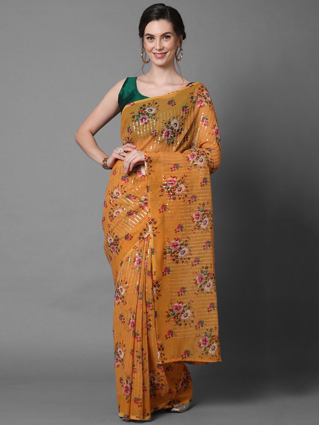 

Mitera Mustard Georgette Floral Printed & Embellished Party Saree