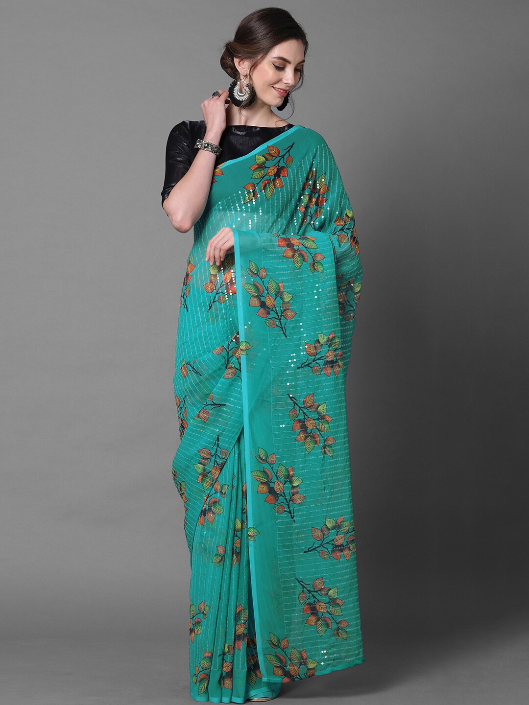 

Mitera Teal Green Georgette Floral Printed & Embellished Party Saree