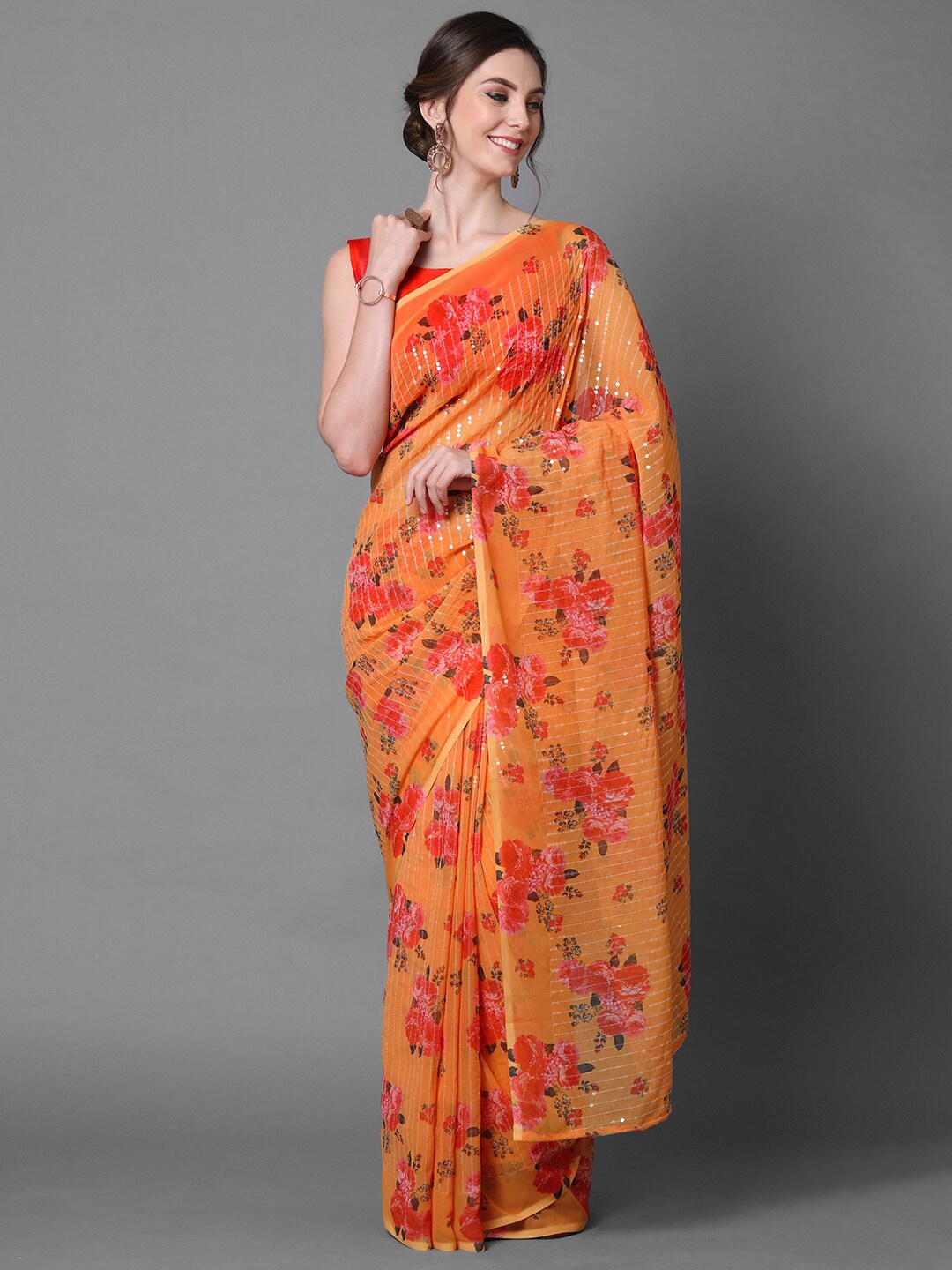 

Mitera Mustard Orange Georgette Floral Printed & Embellished Party Saree