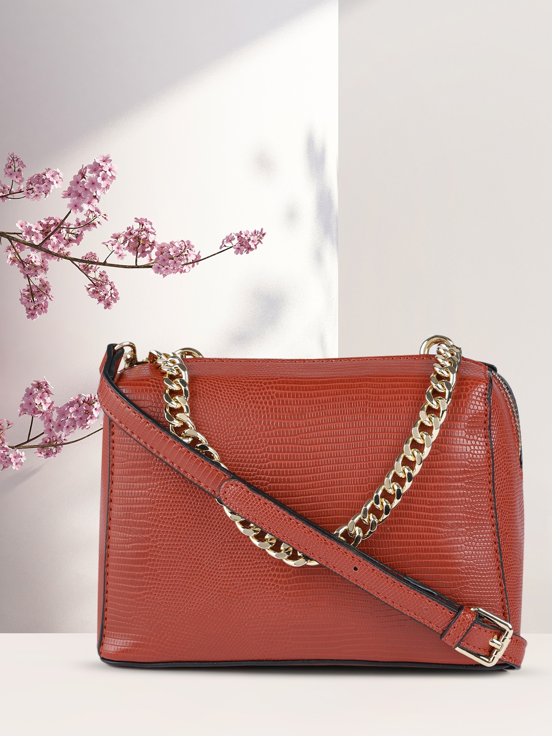 

CORSICA Brick Red Animal Textured Structured Sling Bag