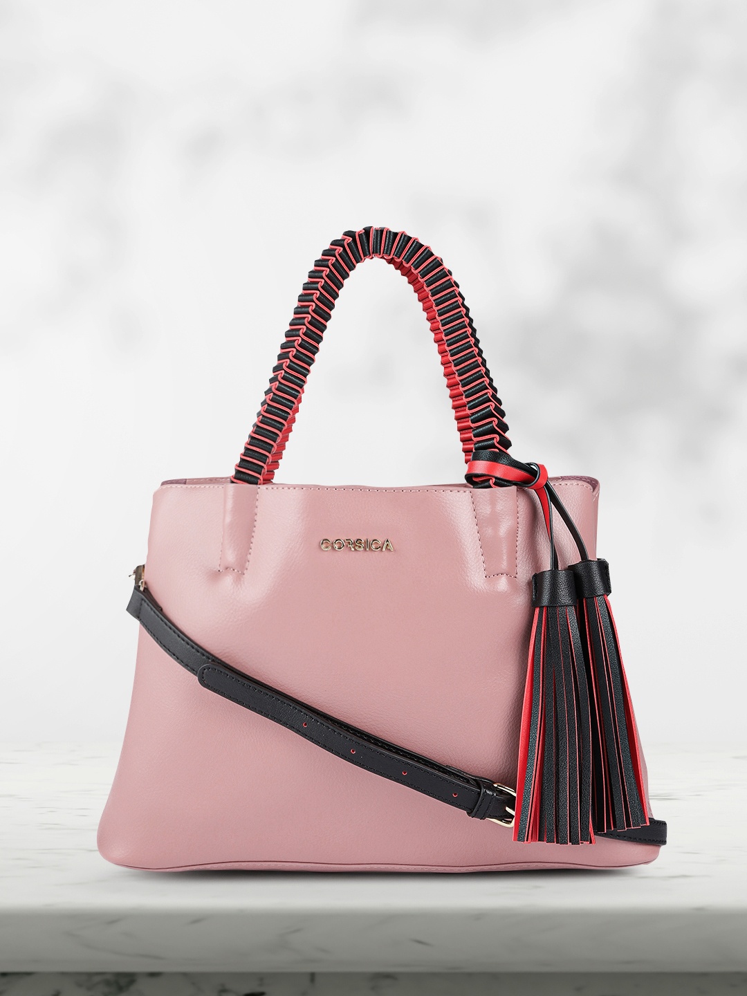 

CORSICA Pink Structured Tasselled Handheld Bag