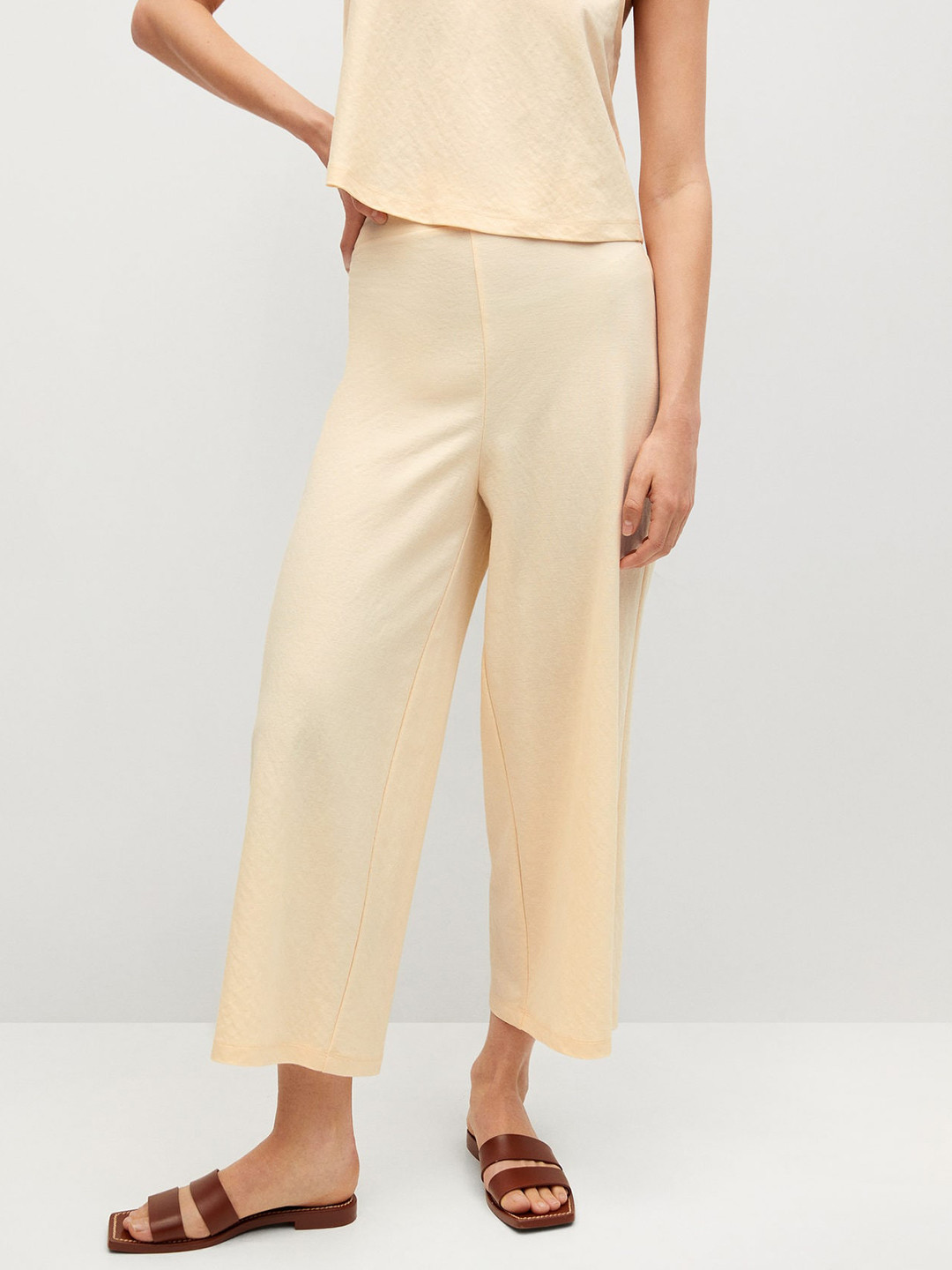 

MANGO Women Cream-Coloured Solid Cropped Parallel Trousers