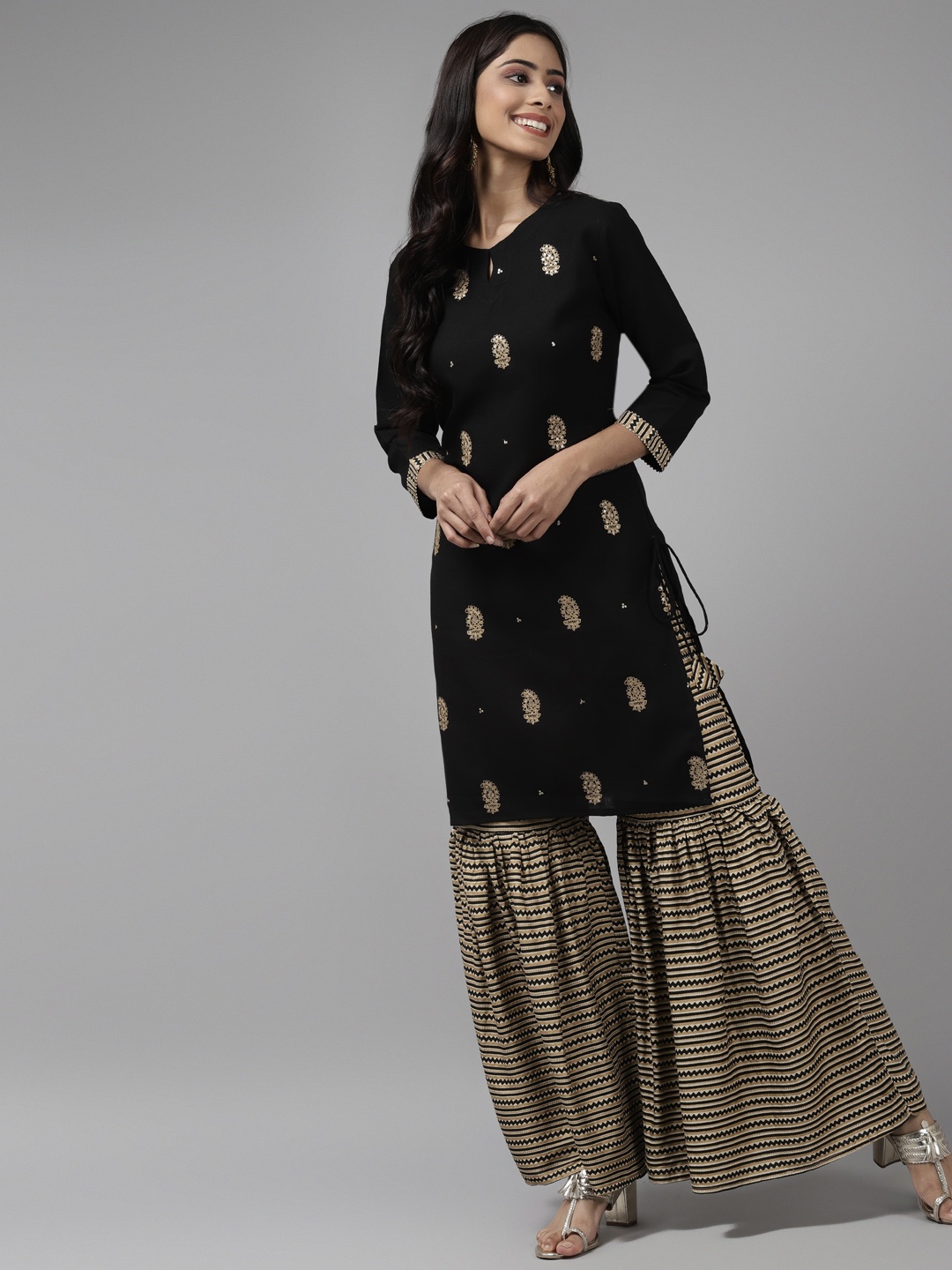 

Indo Era Women Black & Golden Embroidered Sequinned Kurta with Sharara
