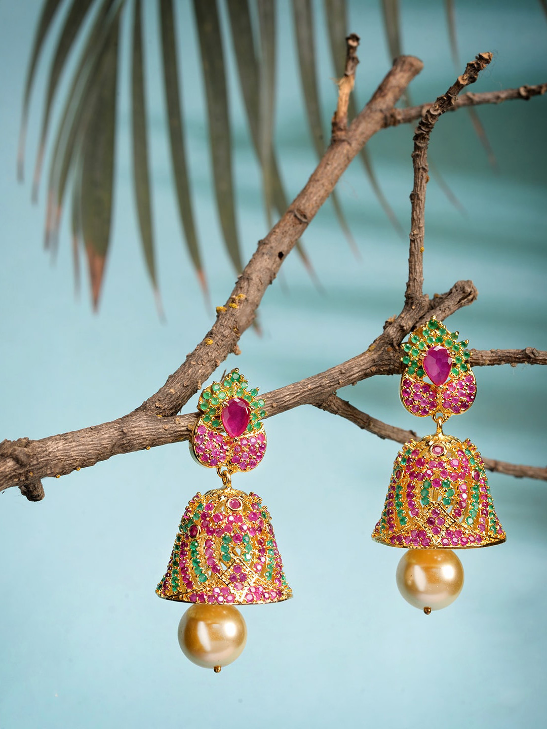 

Saraf RS Jewellery Gold-Pated Pink stone studded & Pearl Beaded Handcrafted Jhumka Earring