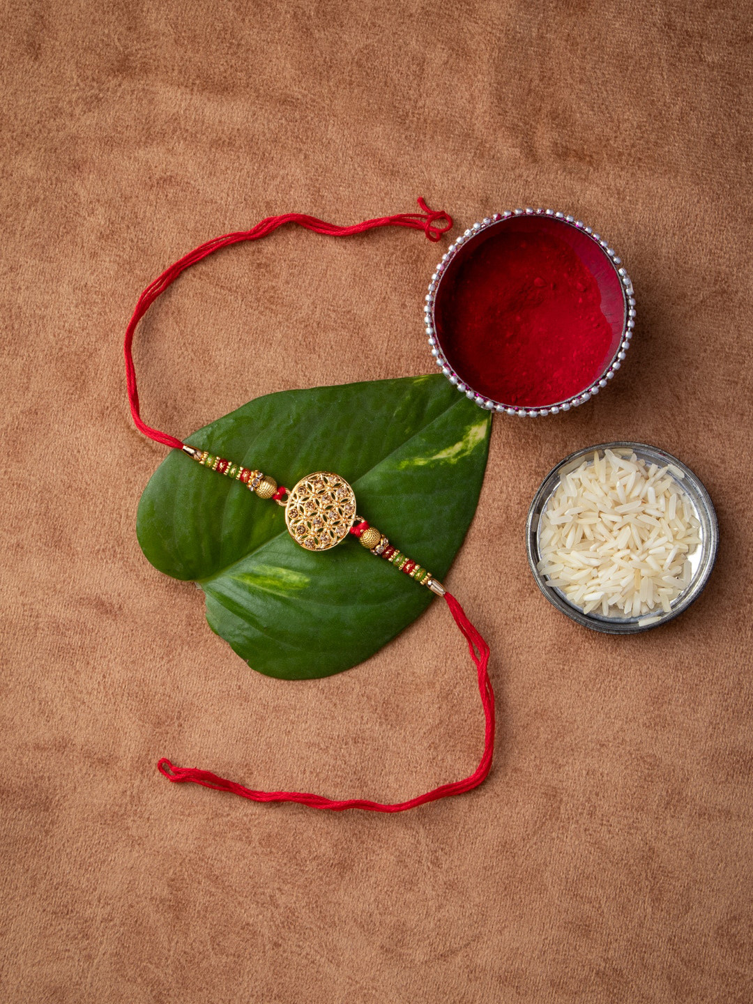 

MORKANTH JEWELLERY Men Gold-Toned Stone-Studded & Red Beaded Handcrafted Rakhi