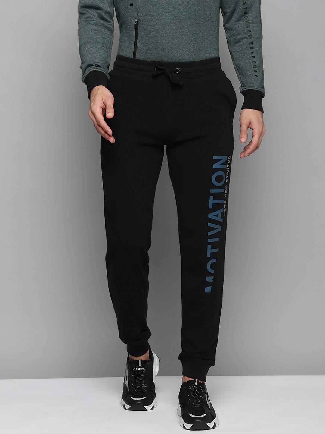 

Alcis Men Black Solid Slim Fit Joggers with Printed Detail