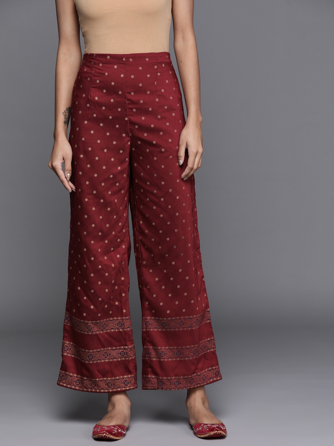 

Libas Women Maroon & Gold Ethnic Motifs Printed Ethnic Palazzos