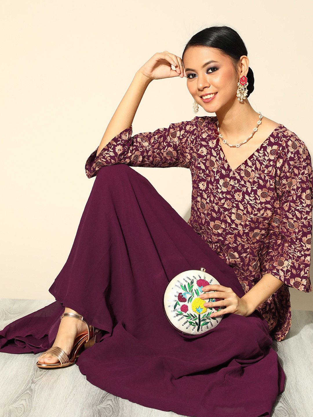 

Libas Women Burgundy & Beige Ethnic Motifs Embroidered Thread Work Kurta with Skirt