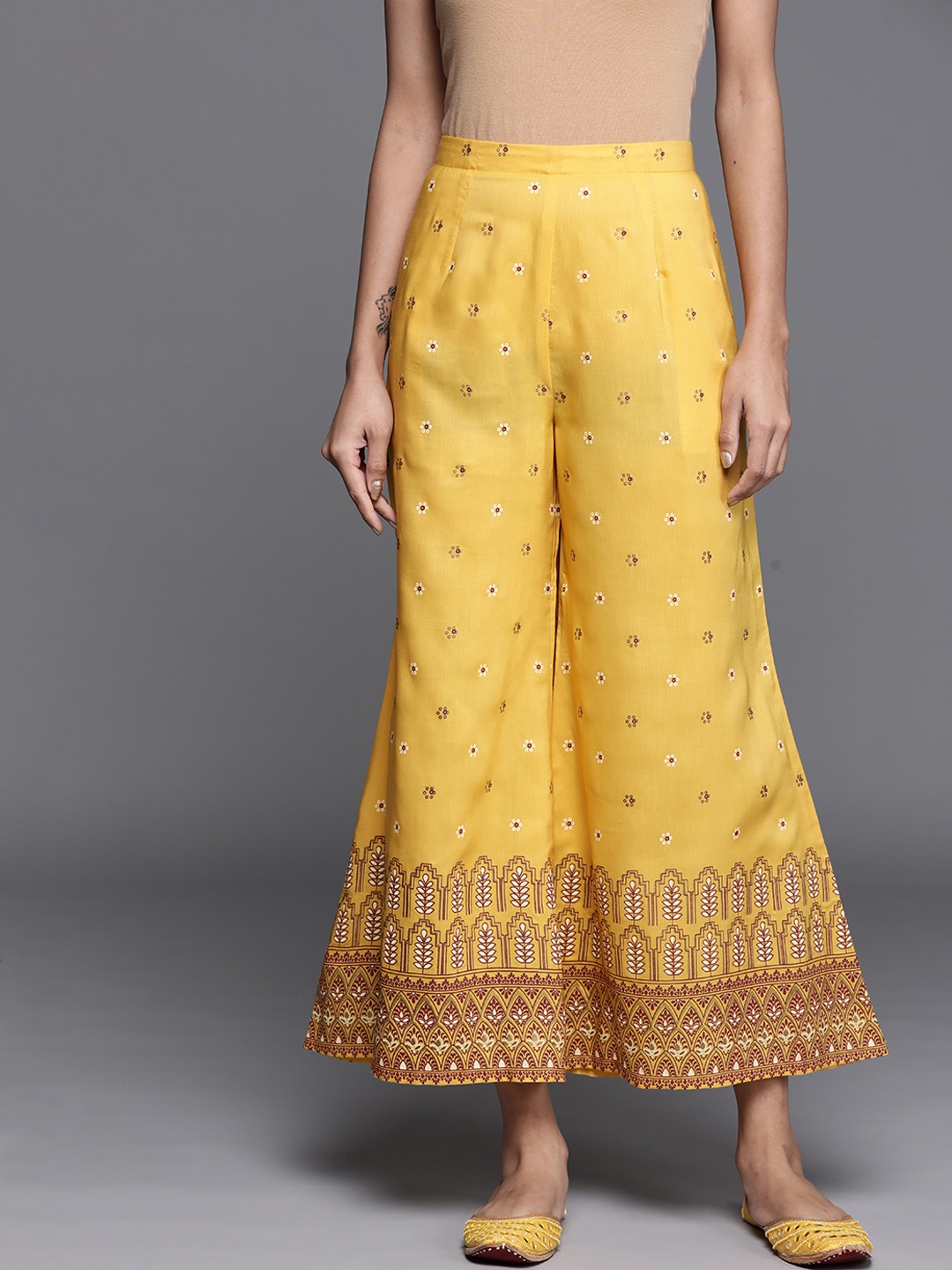 

Libas Women Yellow Ethnic Motifs Printed Flared Ethnic Palazzos