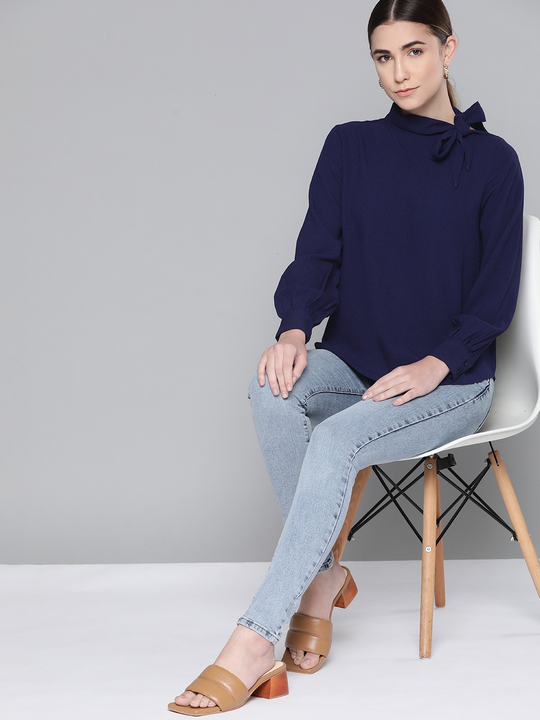 

Chemistry Navy Blue Solid Tie-Up Neck Top with Puff Sleeves