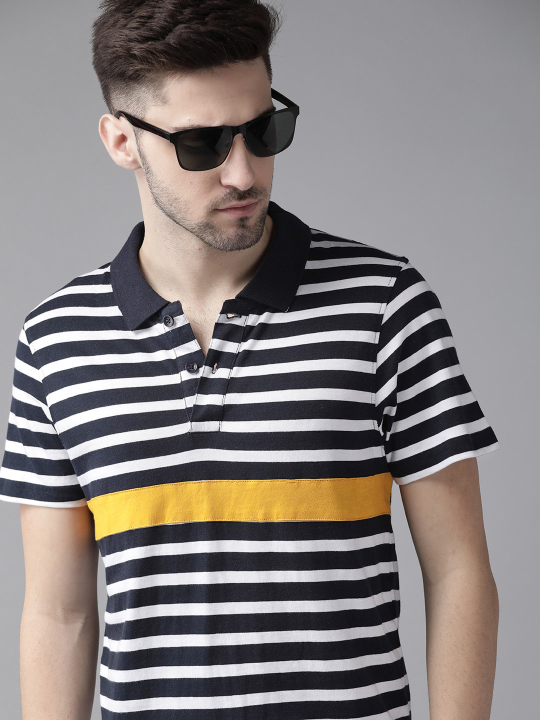 

Roadster Men Navy Blue & White Striped Polo Collar Cotton T-shirt