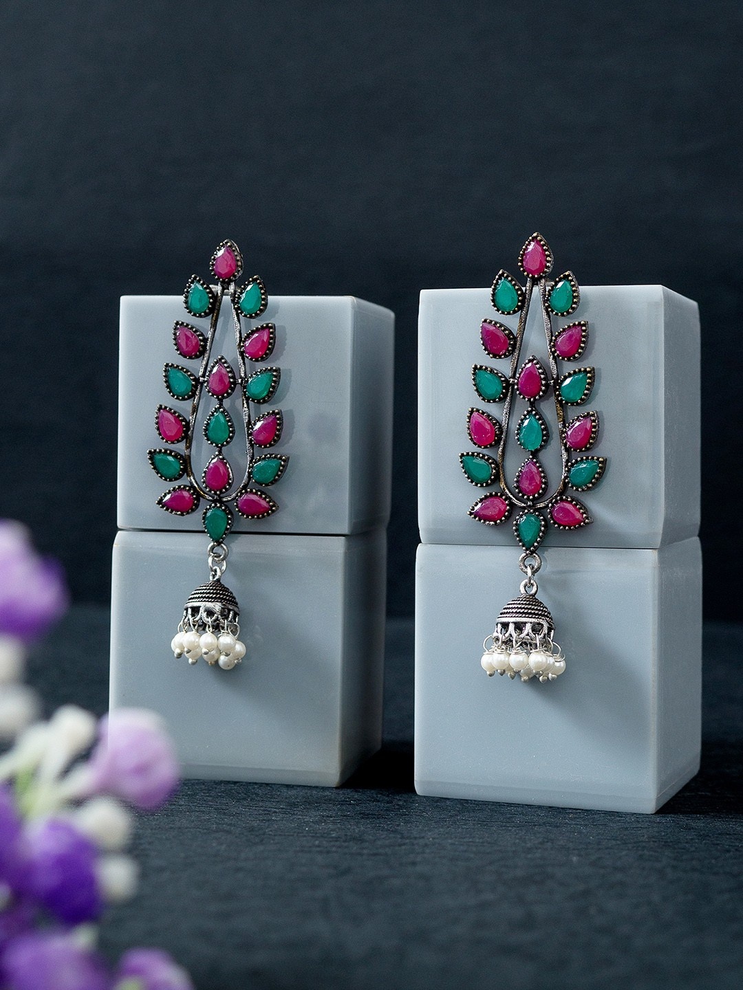 

Golden Peacock Silver-Toned & Green Stone Studded Oxidised Leaf Shaped Jhumkas Earrings