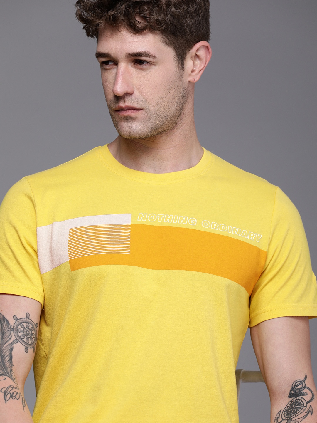 

WROGN Men Yellow Printed Slim Fit Pure Cotton T-shirt